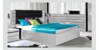 Lit double 160 cm avec option coffre LINA. Coloris blanc et noir brillant avec une finition en simili cuir. Sommier inclus