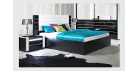 Lit double 160 cm avec option coffre LINA. Coloris noir et blanc brillant avec une finition en simili cuir. Sommier inclus